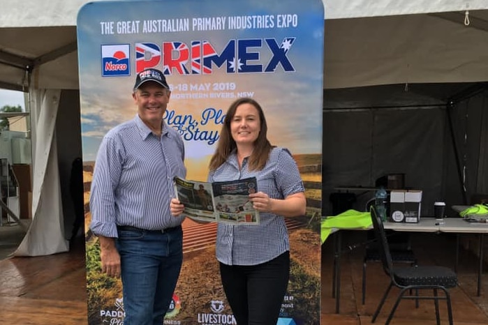 Bruce Wright stands in front of Primex sign with administration manager Sarah Humphreys.