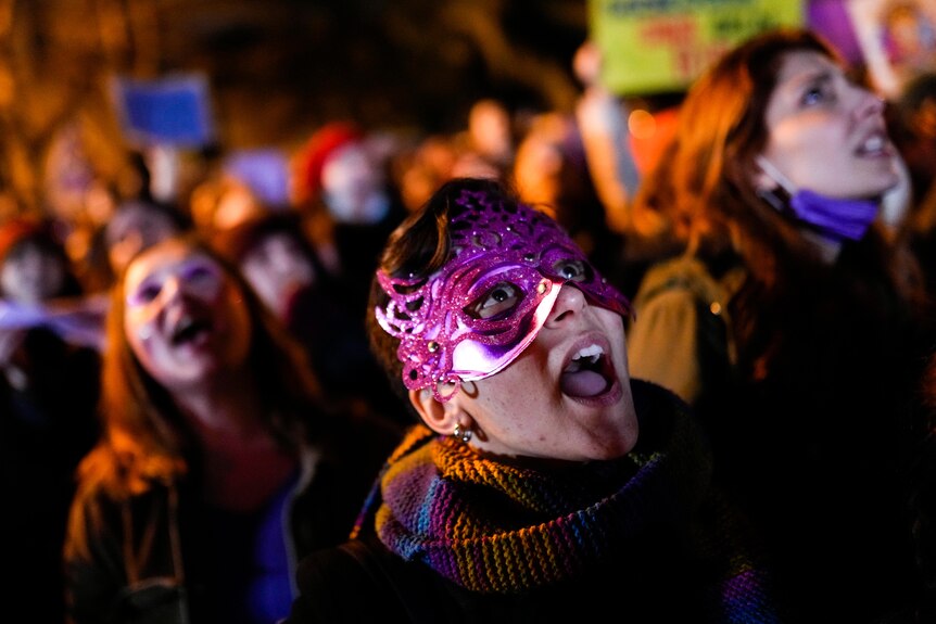 Protesters shout slogans as they march to mark International Women's Day in Istanbul.