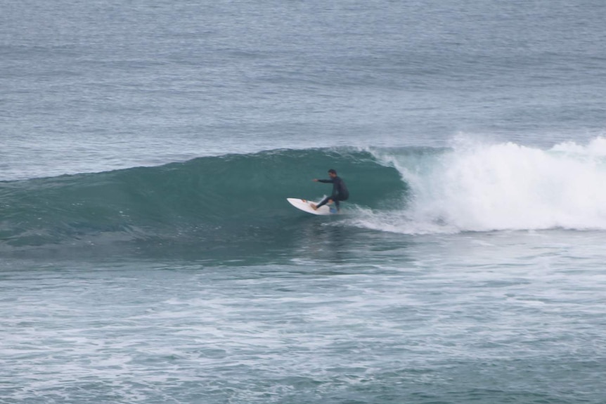 Surfer at Cables Artificial Reef in Perth