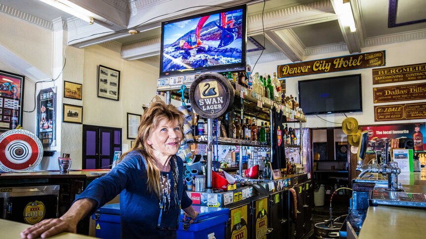 A publican behind the bar of her country hotel.