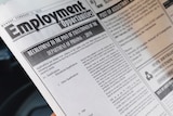 A man reads an advertisement of the vacancy for hangmen on a newspaper in Colombo, Sri Lanka.