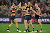 Adelaide Crows' Brad Crouch celebrates a goal with teammates against GWS at Adelaide Oval.