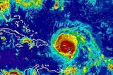 A satellite image shows red-coloured Hurricane Irma in the Caribbean.