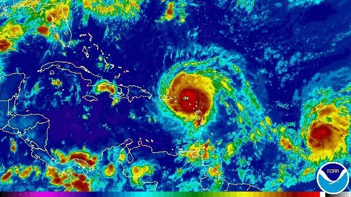 A satellite image shows red-coloured Hurricane Irma in the Caribbean.