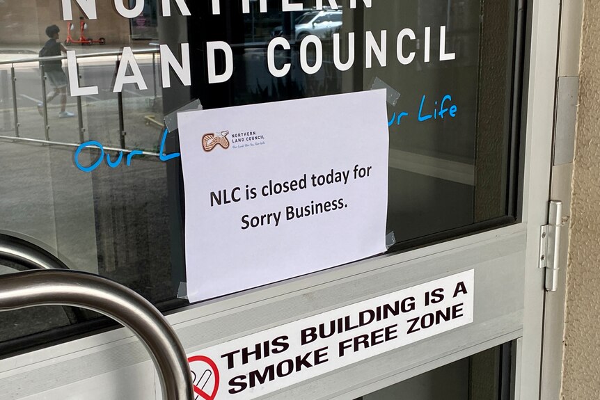 A sign on the door of the Northern Land Council office in Darwin on Monday.