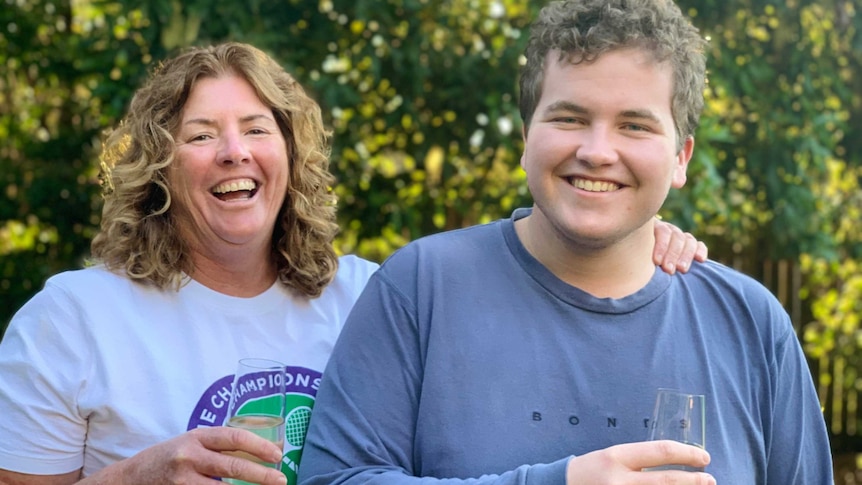 Maria and Isaak Smith with glasses of wine