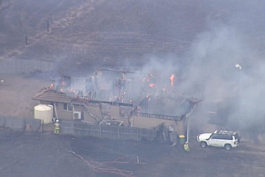 Aerial image of bushfire-ravaged house at Laidley.