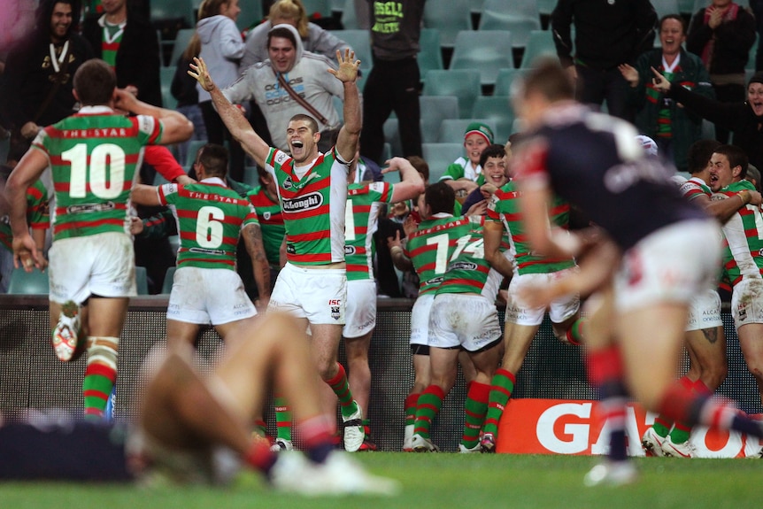 Rabbitohs celebrate their win over the Roosters
