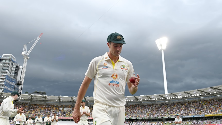 Pat Cummins walks off the Gabba on day one of the Ashes