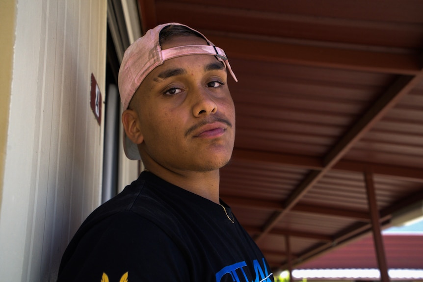 Indigenous boy looking at camera, proud of all he has accomplished while boxing. 