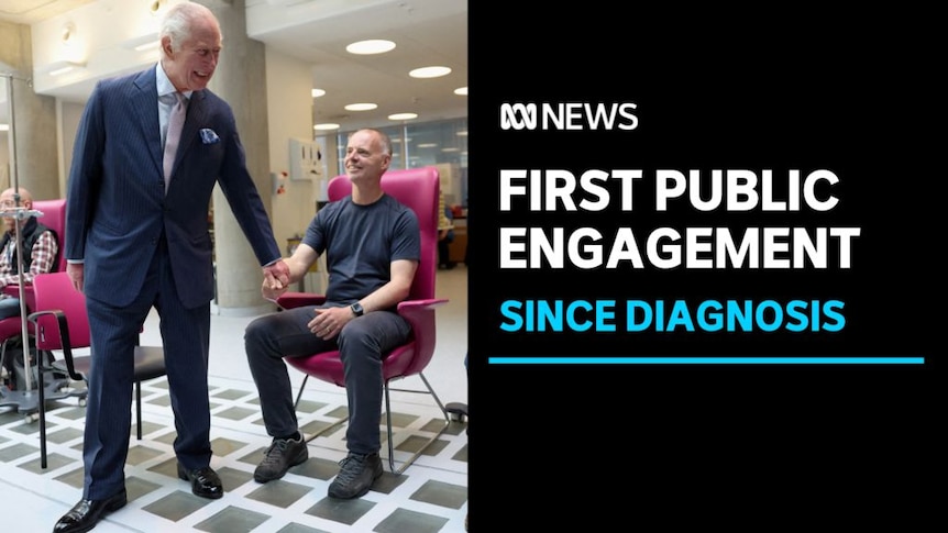 First Public Engagement, Since Diagnosis: King Charles holds the hand of a man sitting in a chair.
