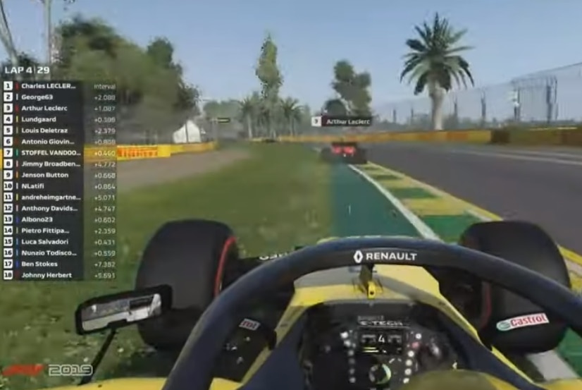 A scene from above a Formula 1 esports race, with a name hovering above the car in front