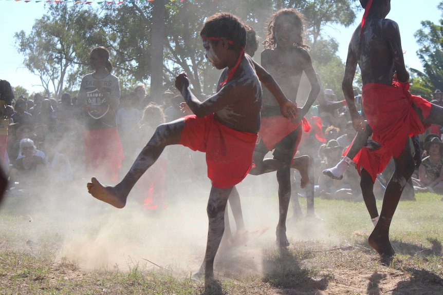 Children dance in traditional dress.