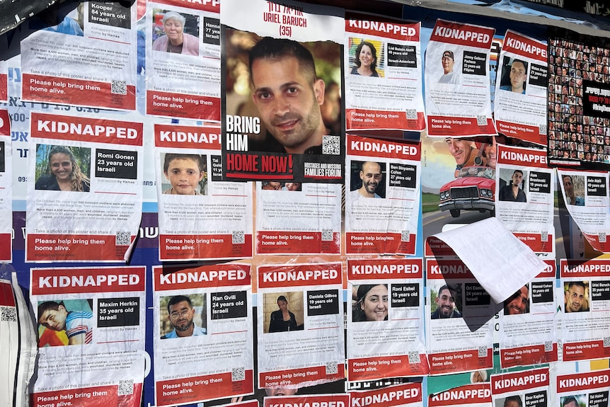 A wall covered in missing posters 