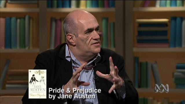 Man sits on set of First Tuesday Book Club, text overlay reads "Pride & Prejudice by Jane Austen"