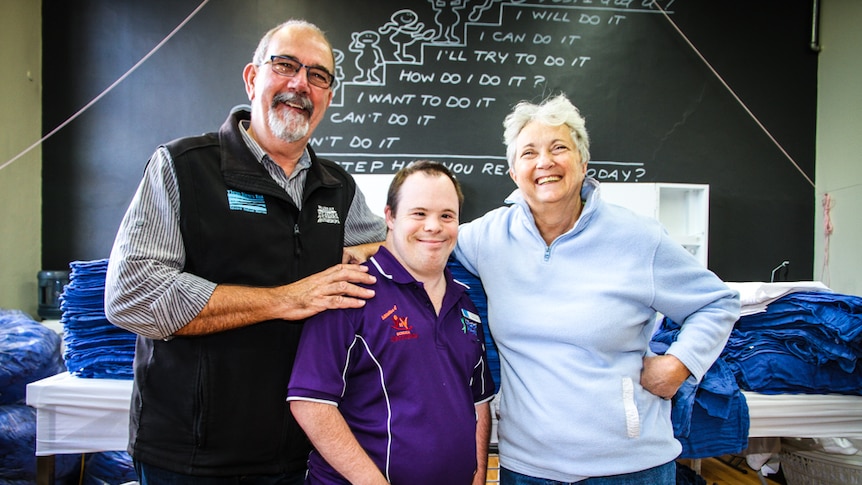 Dick Phillips, Corey Davis and volunteer Cheryl Eckman at Laundry Mates in Echuca.