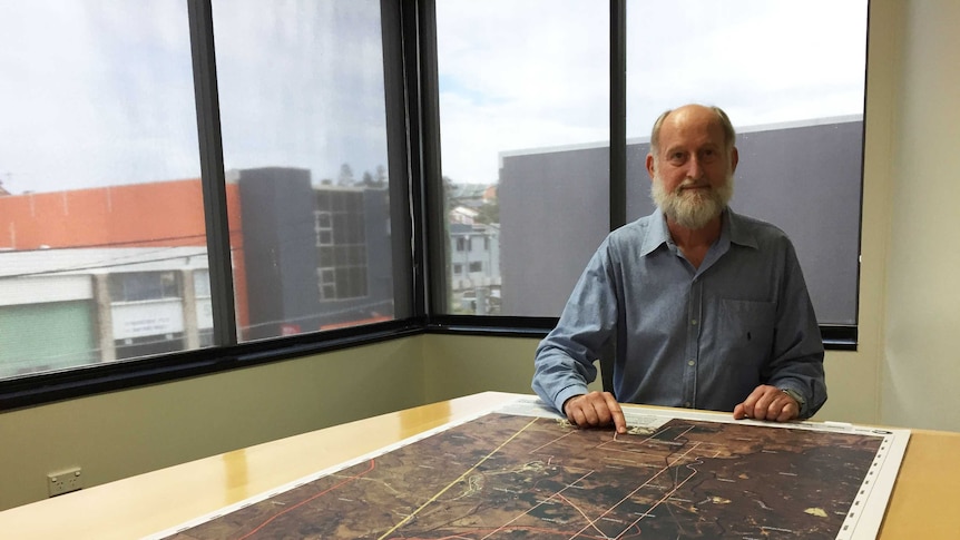 Chris Wallin with a map depicting land the company has a mining lease application on in the Bowen Basin