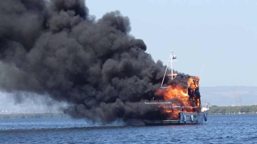 Burning yacht in Barker Inlet
