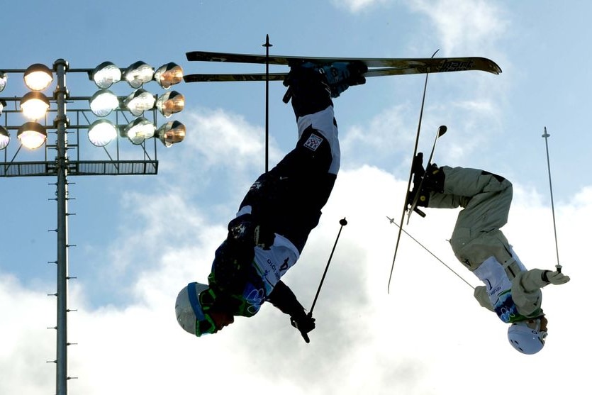 Skiers practise aerial manoeuvres before the men's moguls at the Vancouver Winter Olympics