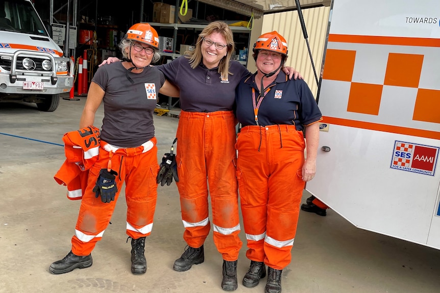 Three women wearing the SES hi vis uniform