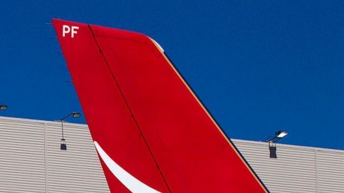 Qantas plane outside hangar
