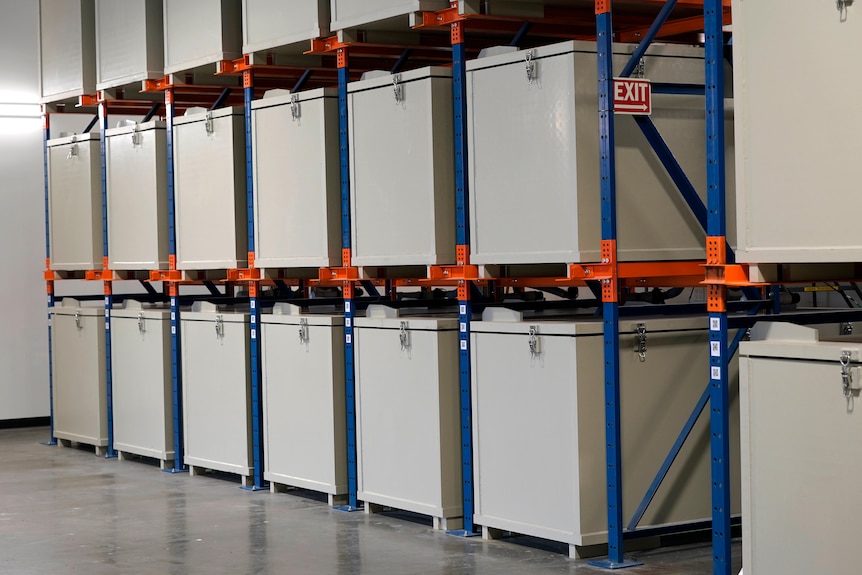 A rack of metal containers where human bodies are kept for the first month of a two month composition process 
