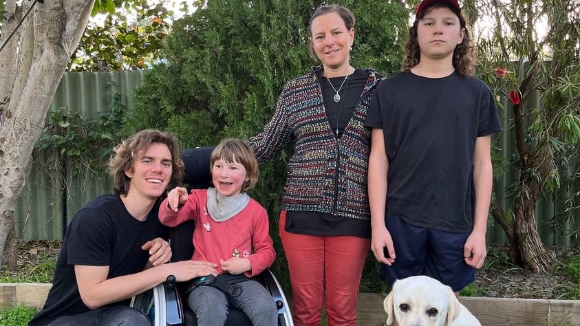 Darshana Lamprecht and her three children and a dog