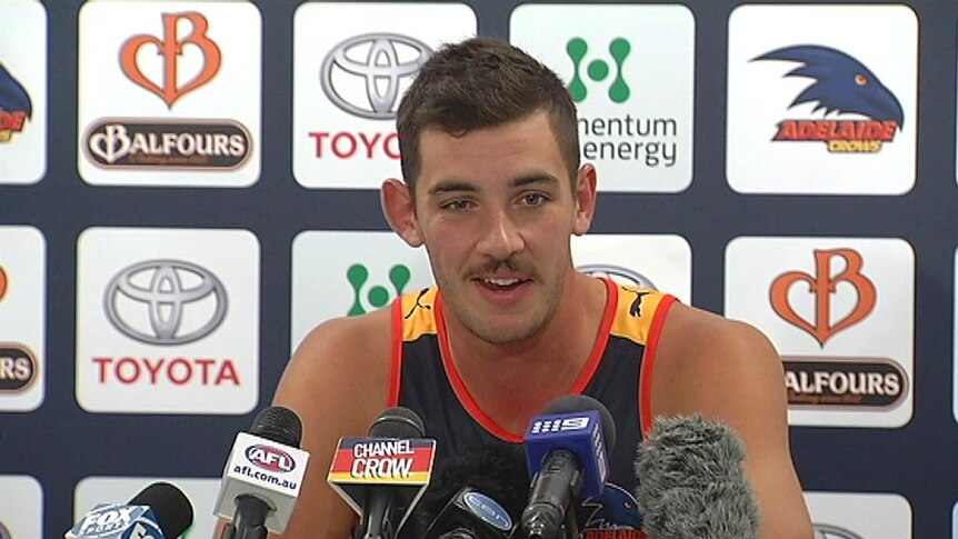 Adelaide Crows player Taylor Walker speaks at a press conference.