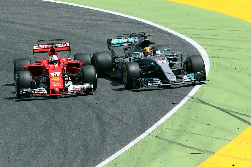 Lewis Hamilton vies with Sebastian Vettel at Spanish Grand Prix