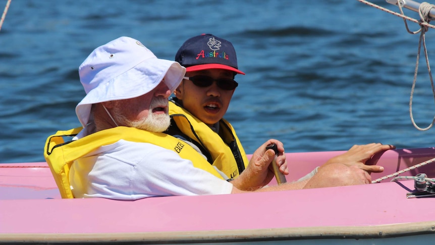 Mark Lim in sailing boat on Swan River