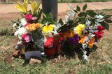 Floral memorials near the site where Kwementyaye Braedon who struck in an alleged hit-and-run incident in Alice Springs.