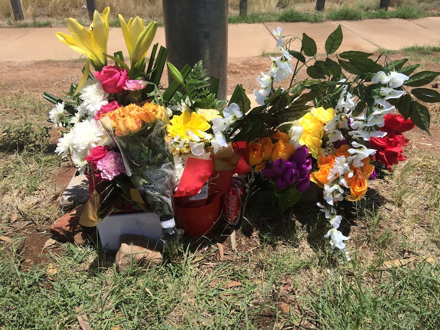 Floral memorials near the site where Kwementyaye Braedon who struck in an alleged hit-and-run incident in Alice Springs.