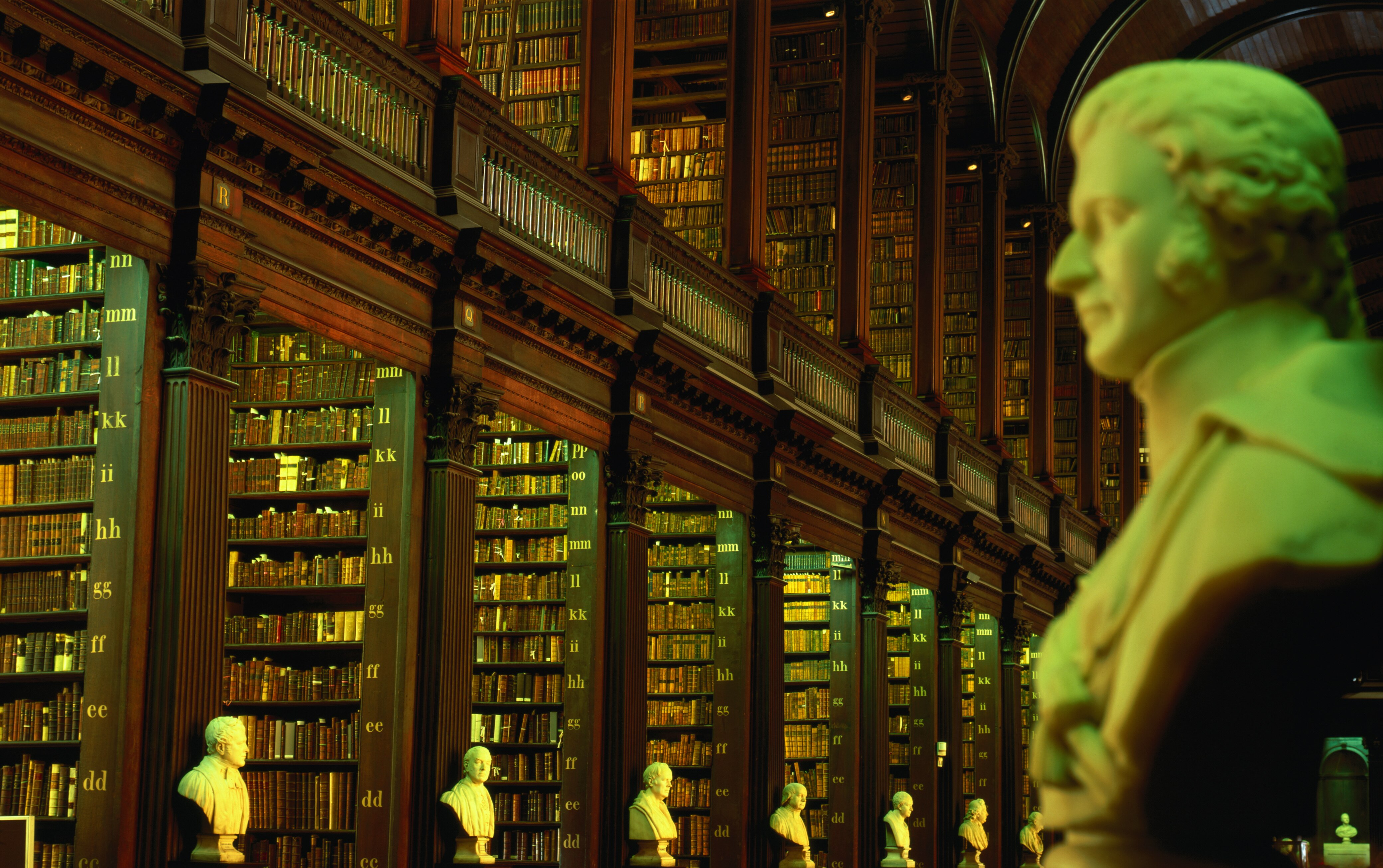 sculpture of European man in old library setting