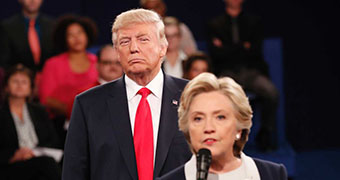 Donald Trump standing behind Clinton during a debate at the time of the US Election 2016.