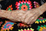 A photo of an old person's hands.