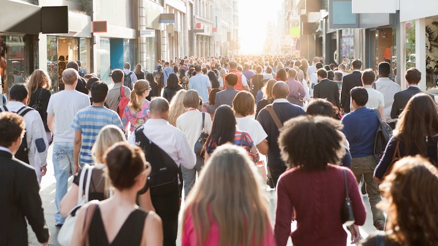 People walking in an outdoor shopping mall.