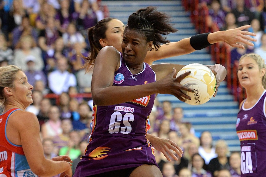 Romelda Aiken contests for the ball against NSW Swifts