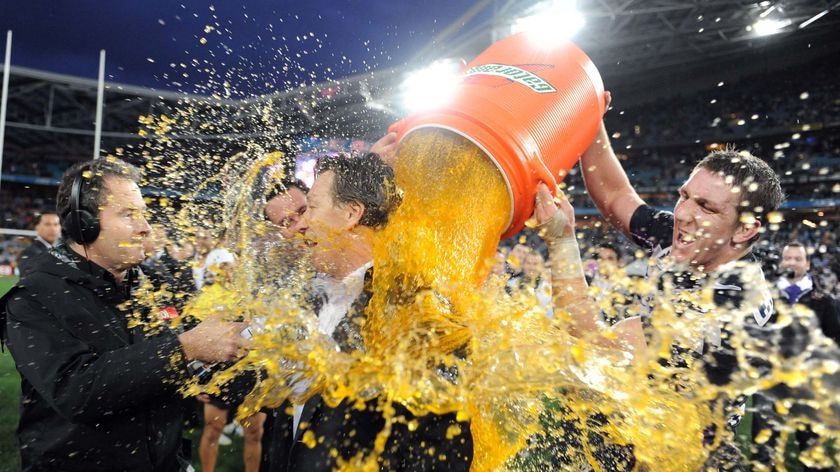 Melbourne Storm coach Craig Bellamy is doused by Ryan Hoffman