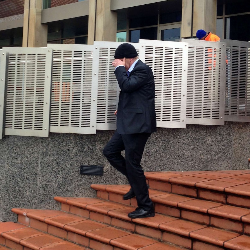 Philip Charles Harrison leaves the Hobart Magistrate's Court after pleading guilty to child sex charges.