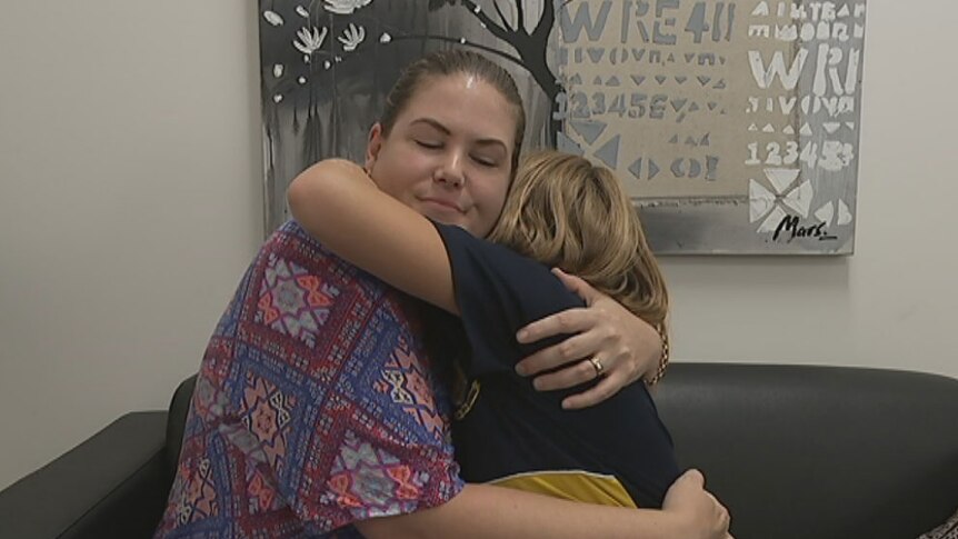 Kelly Mulligan hugs her eight-year-old daughter Ella