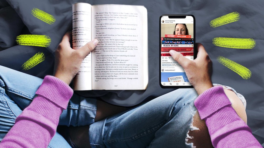 Overhead shot of woman holding a book and a phone with an Instagram feed in either hand.