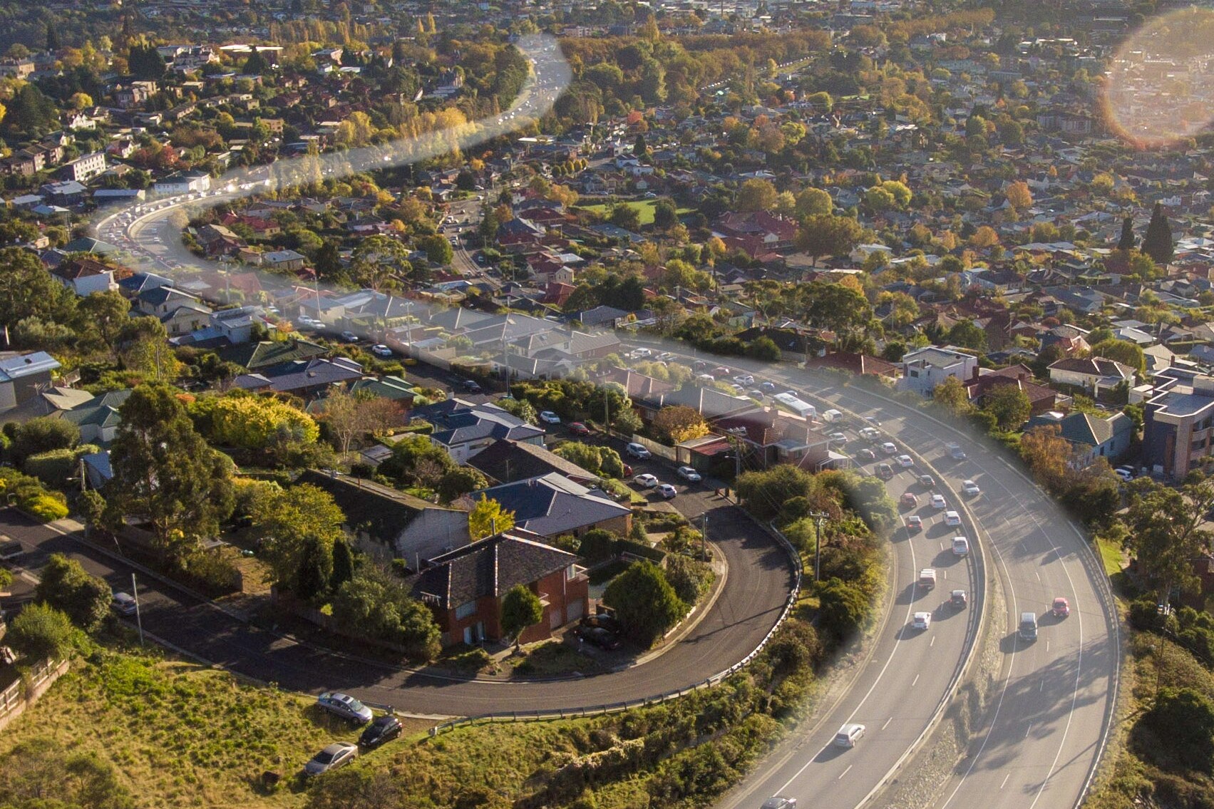 A highlighted road into Hobart, seen from the air.