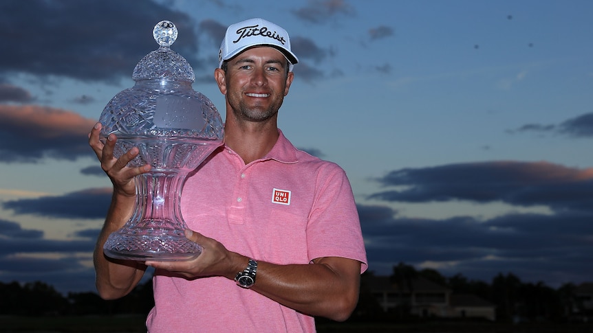 Adam Scott poses with Honda Classic trophy