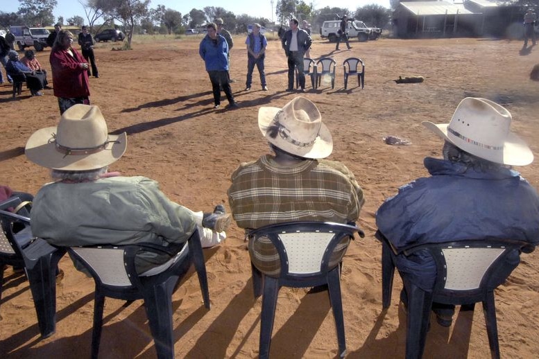 Mutitjulu community members listen to Indigenous Affairs Minister Mal Brough in 2007