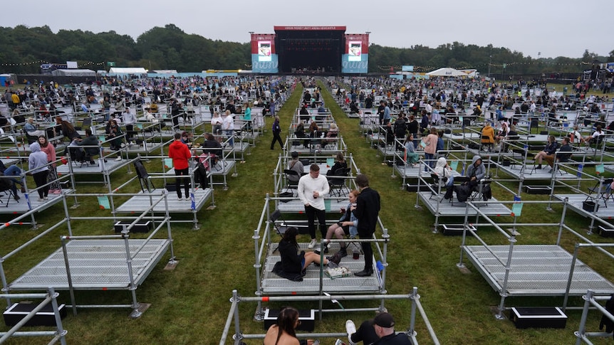 Fans wait in socially distanced enclosures to see Sam Fender perform at a venue in the UK.