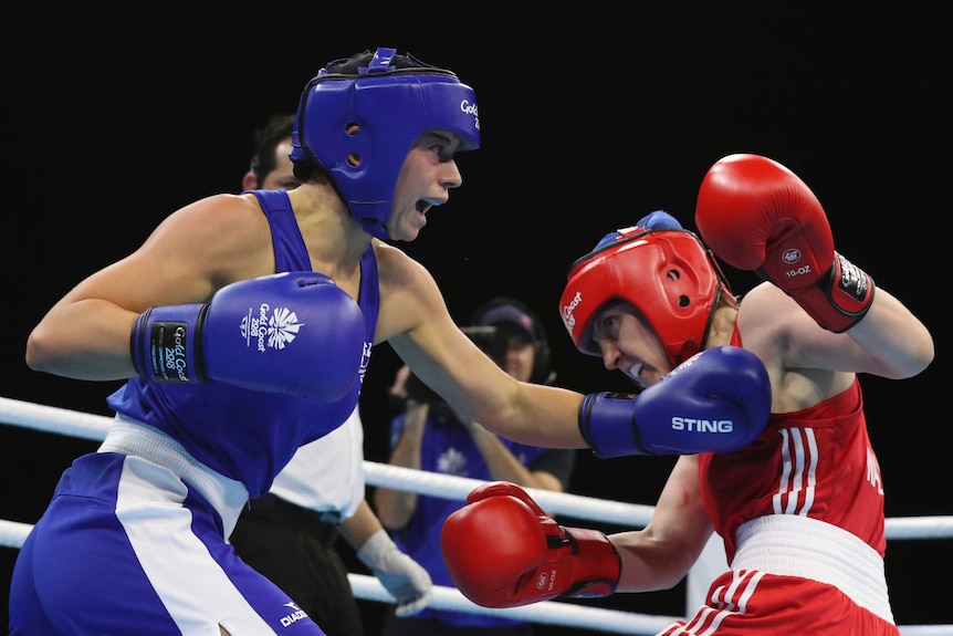 Australia's Skye Nicolson (L), against Northern Ireland's Michaela Walsh in women's 57kg boxing.