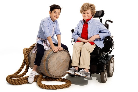 Photos of young boys wearing the adaptive clothing range
