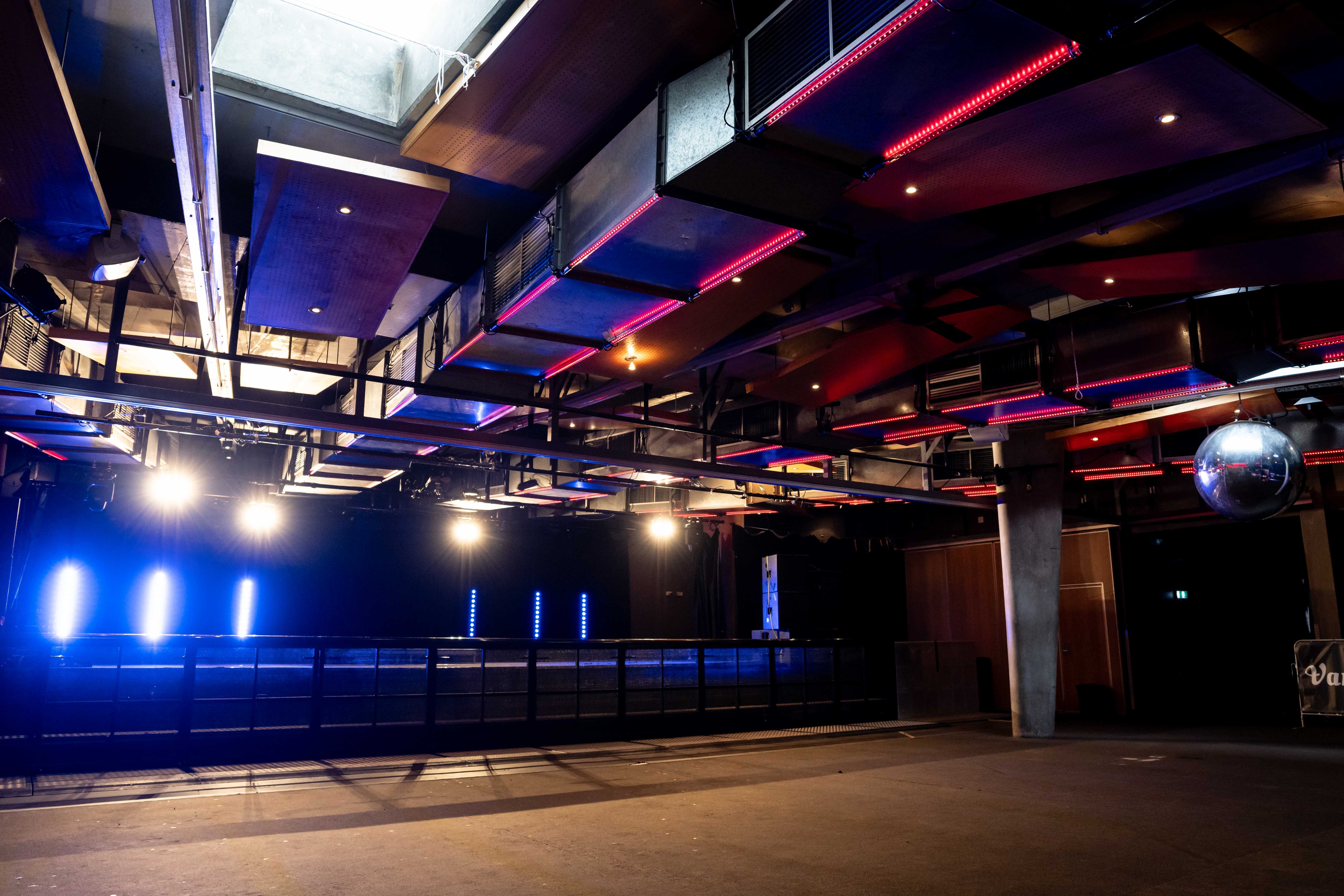 A stage with bright colourful lights lit up