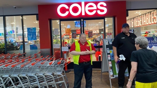 People outside a Coles