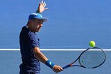 Alex de Minaur volleys back to Sam Querrey at the Australian Open